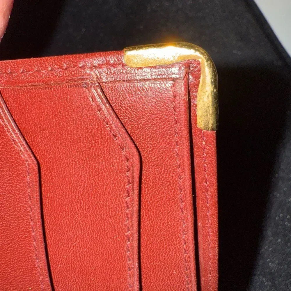 Never used Cartier red burgundy wallet comes with original box